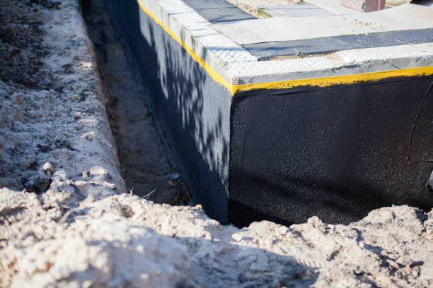 Professional Basement Waterproofing technician working in Daleville, AL
